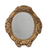 A LARGE CARVED GILTWOOD AND GESSO 'OCULUS' MIRROR, LATE 17TH OR EARLY 18TH CENTURY