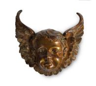 A BRONZE WINGED CHERUB MASK, 17TH OR EARLY 18TH CENTURY