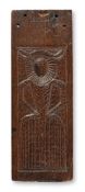 AN ELIZABETH I CARVED OAK PANEL, CIRCA 1580