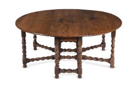 A LARGE CHARLES II DOUBLE GATELEG ELM AND OAK DROP LEAF DINING TABLE, CIRCA 1680