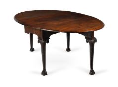 A GEORGE II WALNUT AND CARVED WALUT GATE-LEG TABLE, CIRCA 1740