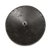 A GERMAN CIRCULAR STEEL SHIELD OF SHOT-PROOF WEIGHT, NUREMBURG, LATE 16TH OR EARLY 17TH CENTURY