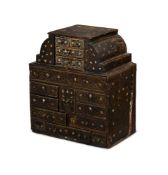 Y A RARE CHARLES I JAPANNED AND MOTHER OF PEARL INLAID TABLE CABINET, CIRCA 1630