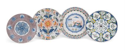 A GROUP OF FOUR ENGLISH POLYCHROME DELFT PLATES, 18TH CENTURY