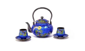 A Korean silver enamelled teapot and matching cups and saucers