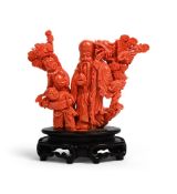 Y A Chinese carved coral group of shoulao and boys