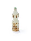 A Mughal small white jade gem-set gold inlaid bottle