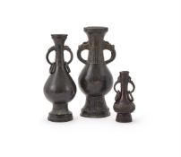 Two Chinese bronze dragon-mask two-handled vases