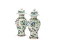 Two Chinese large Famille Verte vases and covers