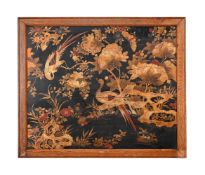 A Chinese lacquered and gilt wooden panel