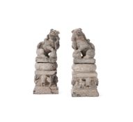 A pair of carved limestone Buddhistic lions