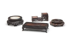 A group of four assorted Chinese hardwood stands