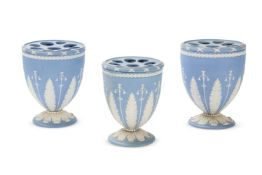 THREE WEDGWOOD PALE-BLUE SOLID JASPER URN-SHAPED BULB POTS AND PIERCED COVERSEARLY 19TH CENTURYSpr