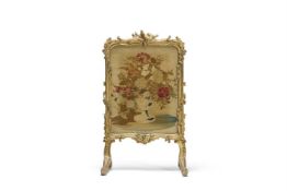 A VICTORIAN CARVED GILTWOOD FIRESCREEN, MID 19TH CENTURY