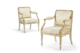 A PAIR OF GEORGE III CREAM-PAINTED AND PARCEL-GILT ARMCHAIRS, LATE 18TH CENTURY