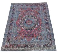 A LARGE KIRMAN CARPET
