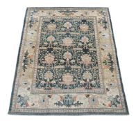 AN USHAK CARPET, AFTER DESIGNS BY C.F.A. VOYSEY