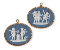 A PAIR OF WEDGWOOD & BENTLEY SOLID BLUE JASPER GILT METAL MOUNTED OVAL PLAQUES