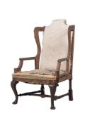 A GEORGE I WALNUT WING ARMCHAIR, CIRCA 1730