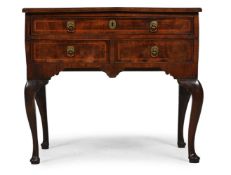 A GEORGE II WALNUT AND FEATHERBANDED SIDE TABLE OR LOWBOY, CIRCA 1735
