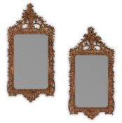 A LARGE PAIR OF CARVED GILTWOOD MIRRORS, IN GEORGE III STYLE, 19TH CENTURY