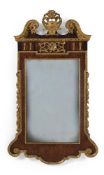A GEORGE II FIGURED WALNUT AND PARCEL-GILT WALL MIRROR, CIRCA 1730-1740