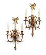 A PAIR OF GILT BRONZE THREE BRANCH WALL LIGHTS, IN LOUIS XVI STYLE, 20TH CENTURY