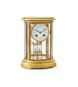 A FRENCH LACQUERED BRASS OVAL FOUR-GLASS MANTEL CLOCK
