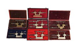 A COLLECTION OF SEVEN SWISS OR GERMAN BRASS AND STEEL JACOT PIVOT POLISHING TOOLS