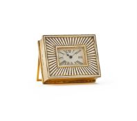A GEORGE V ART DECO SILVER GILT AND WHITE ENAMEL TRAVELLING TIMEPIECE