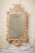 A GEORGE III CARVED GILTWOOD MIRROR, POSSIBLY IRISH, CIRCA 1770