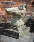 A COTSWOLD STONE BIRDBATH, EARLY 19TH CENTURY