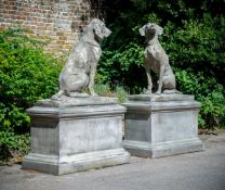 A LARGE PAIR OF STONE COMPOSITION SEATED DOGS ON PEDESTALS, CONTEMPORARY