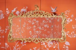 A GEORGE III CARVED GILTWOOD TRIPTYCH MIRROR, CIRCA 1770