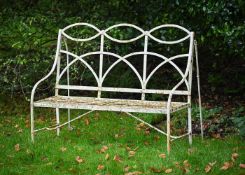 A REGENCY WHITE PAINTED STRAPWORK GARDEN SEAT, EARLY 19TH CENTURY