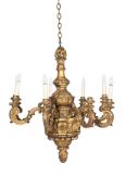 A CARVED GILTWOOD SEVEN LIGHT CHANDELIER IN THE MANNER OF LENYGON & CO, EARLY 20TH CENTURY