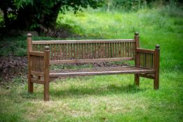 A HARDWOOD GARDEN BENCH, ATTRIBUTED TO HEALS, 20TH CENTURY