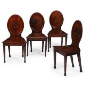 A SET OF FOUR GEORGE III MAHOGANY HALL CHAIRS, IN THE MANNER OF INCE & MAYHEW, CIRCA 1780