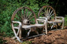 A PAIR OF WOODEN WAGON WHEEL BACK GARDEN BENCHES, CONTEMPORARY