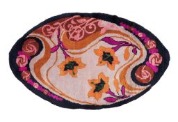 A FRENCH OVAL RUG; 20TH CENTURY