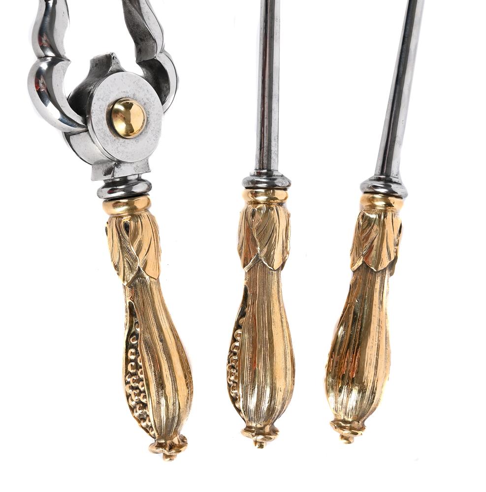 A SET OF THREE MID VICTORIAN STEEL AND BRASS FIRE TOOLS, CIRCA 1860 - Image 2 of 2