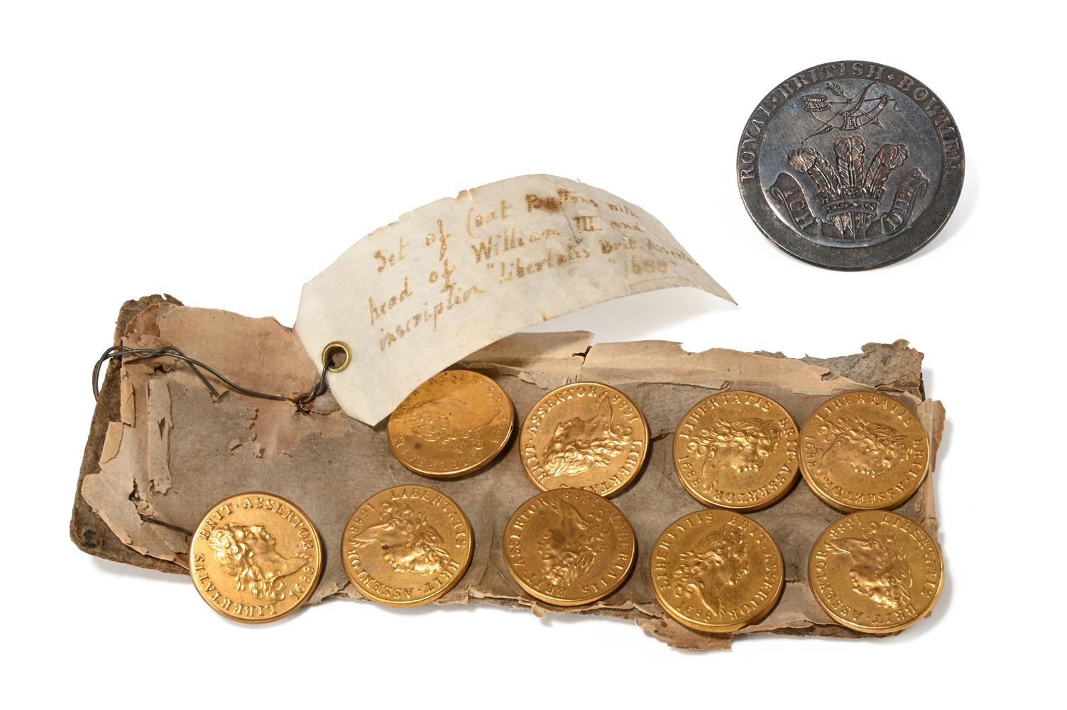 A SET OF NINE WILLIAM III GILT COPPER BUTTONS, DATED 1688