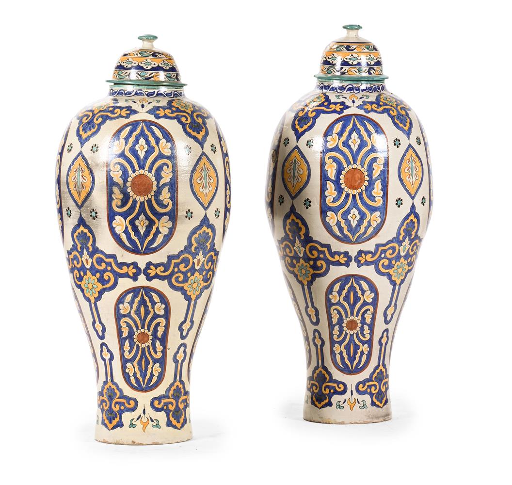 A PAIR OF MOROCCAN IZNIK STYLE LARGE POTTERY JARS AND COVERS, LATE 19TH OR 20TH CENTURY
