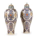 A PAIR OF MOROCCAN IZNIK STYLE LARGE POTTERY JARS AND COVERS, LATE 19TH OR 20TH CENTURY