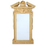 ‡ A GEORGE II CARVED GILTWOOD MIRROR, CIRCA 1740