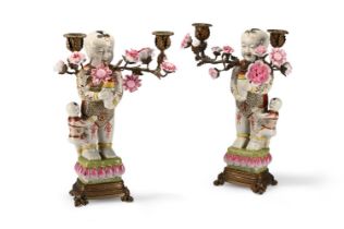 A PAIR OF CHINESE FAMILLE ROSE TWO-LIGHT CANDLELABRA OF BOYS, MODERN