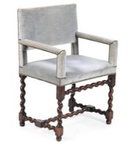 A WALNUT AND UPHOLSTERED ARMCHAIR, IN 16TH OR 17TH CENTURY STYLE, EARLY 20TH CENTURY