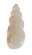 A CARVED CHINESE WHITE AND RUSSET JADE PENDANT