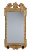 A GEORGE II CARVED GILTWOOD GIRANDOLE MIRROR, IN THE MANNER OF WILLIAM KENT, CIRCA 1740