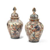 A PAIR OF OCTAGONAL IMARI VASES WITH COVERS, EDO PERIOD, LATE 17TH OR EARLY 18TH CENTURY